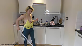 Watch Delilah Clean The Kitchen In A Sexy Brown Outfit And Give A Great View Of Her Tits